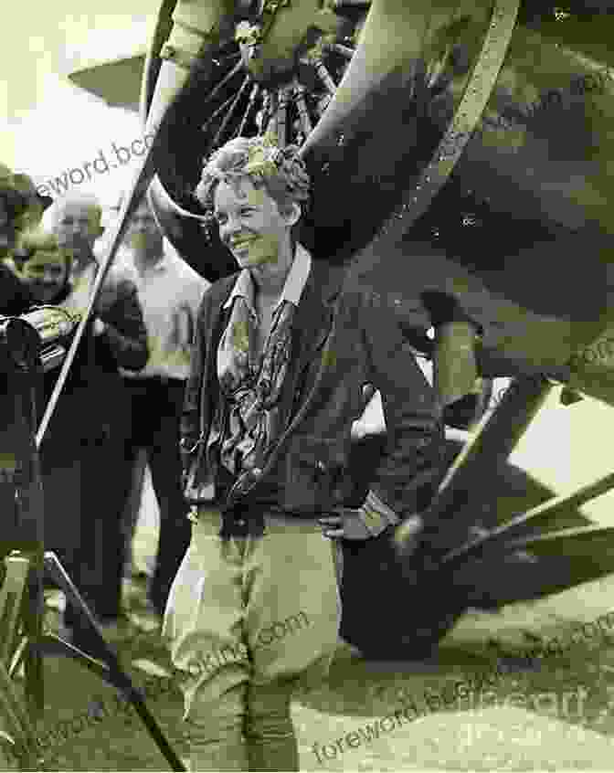 A Black And White Photograph Of Amelia Earhart In Her Flight Suit, Standing In Front Of Her Plane. Trailblazers: Amelia Earhart: First Woman Over The Atlantic