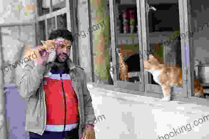 Mohammad Alaa Aljaleel Holding A Cat In Aleppo The Cat Man Of Aleppo